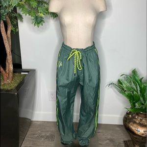 Women oversize Green Track/ windbreaker pants small.Sits on hips or high waist